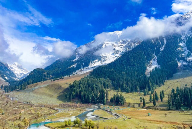 Photographer capturing the stunning landscapes during the Photography Tour of Kashmir