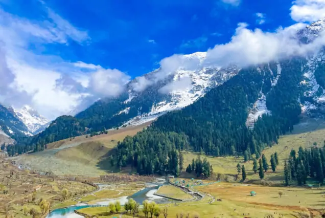 Photographer capturing the stunning landscapes during the Photography Tour of Kashmir