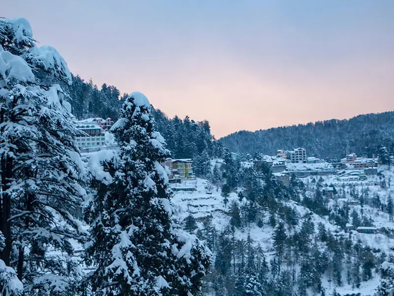 Scenic view from Shimla tour package itinerary with snow peaks and cultural sites
